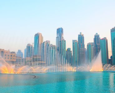 photo-of-water-fountain-across-high-rise-buildings-3145426